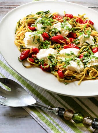 Tomatoes and Burrata Zucchini Noodles shown on serving platter.