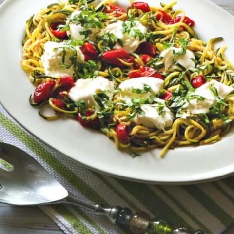 Garlicky Zucchini Noodles with Tomatoes and Burrata close-up photo