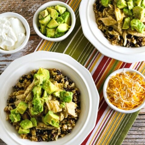 Slow Cooker Green Chile Chicken Burrito Bowl finished burrito bowls with toppings