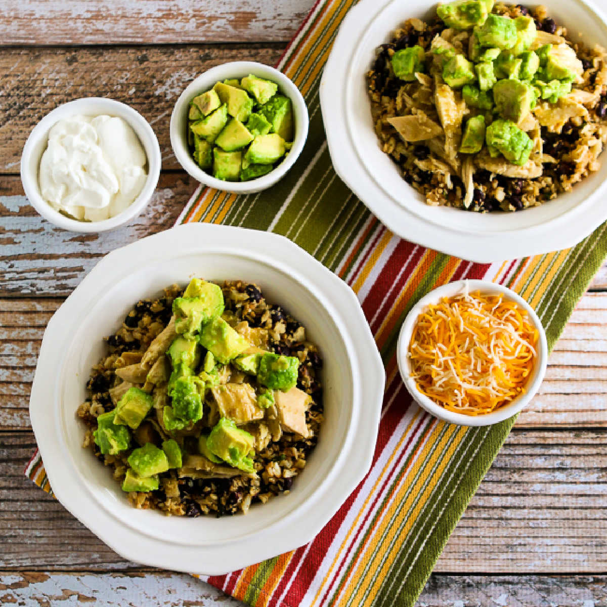 Square image for Slow Cooker Green Chile Chicken Bowl showing finished bowls and topping.
