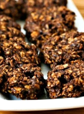 Square image for Sugar-Free Flourless Chocolate Oatmeal Cluster Cookies shown on white serving dish.