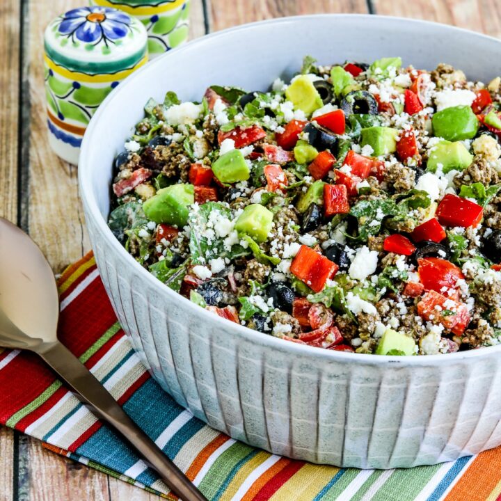 Ground Beef Taco Salad with Kale, Tomatoes, and Avocado shown in serving bowl.