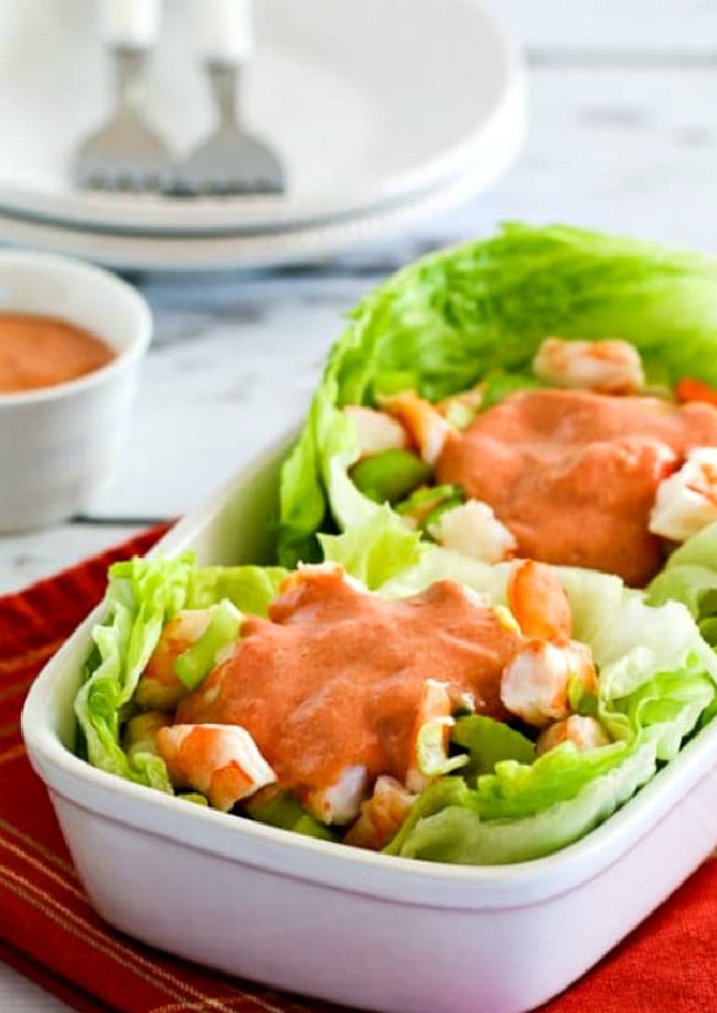 Shrimp Cocktail Lettuce Cups close-up image of lettuce cups in serving dish with sauce