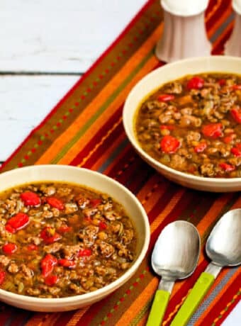 square image of Sausage and Lentil Soup in two serving bowls