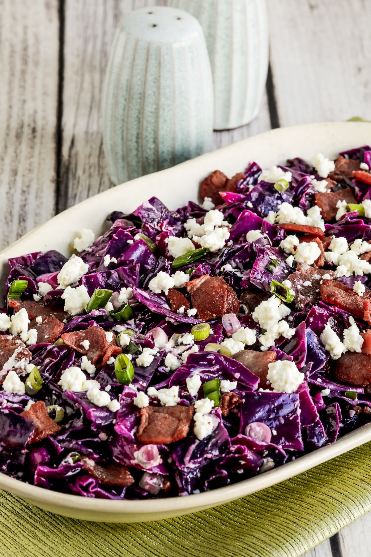 Red Cabbage Salad with Bacon and Goat Cheese shown on serving plate