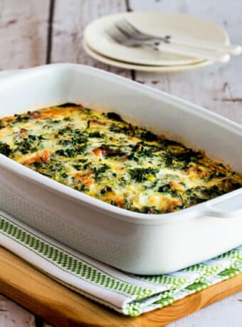 Square image for Kale, Bacon, and Cheese Breakfast Casserole shown in baking dish.