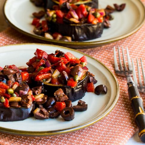 Mediterranean Eggplant on two plates with red pepper salsa
