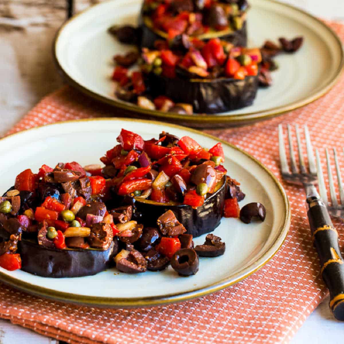 Square image of Mediterranean Eggplant on two serving plates.