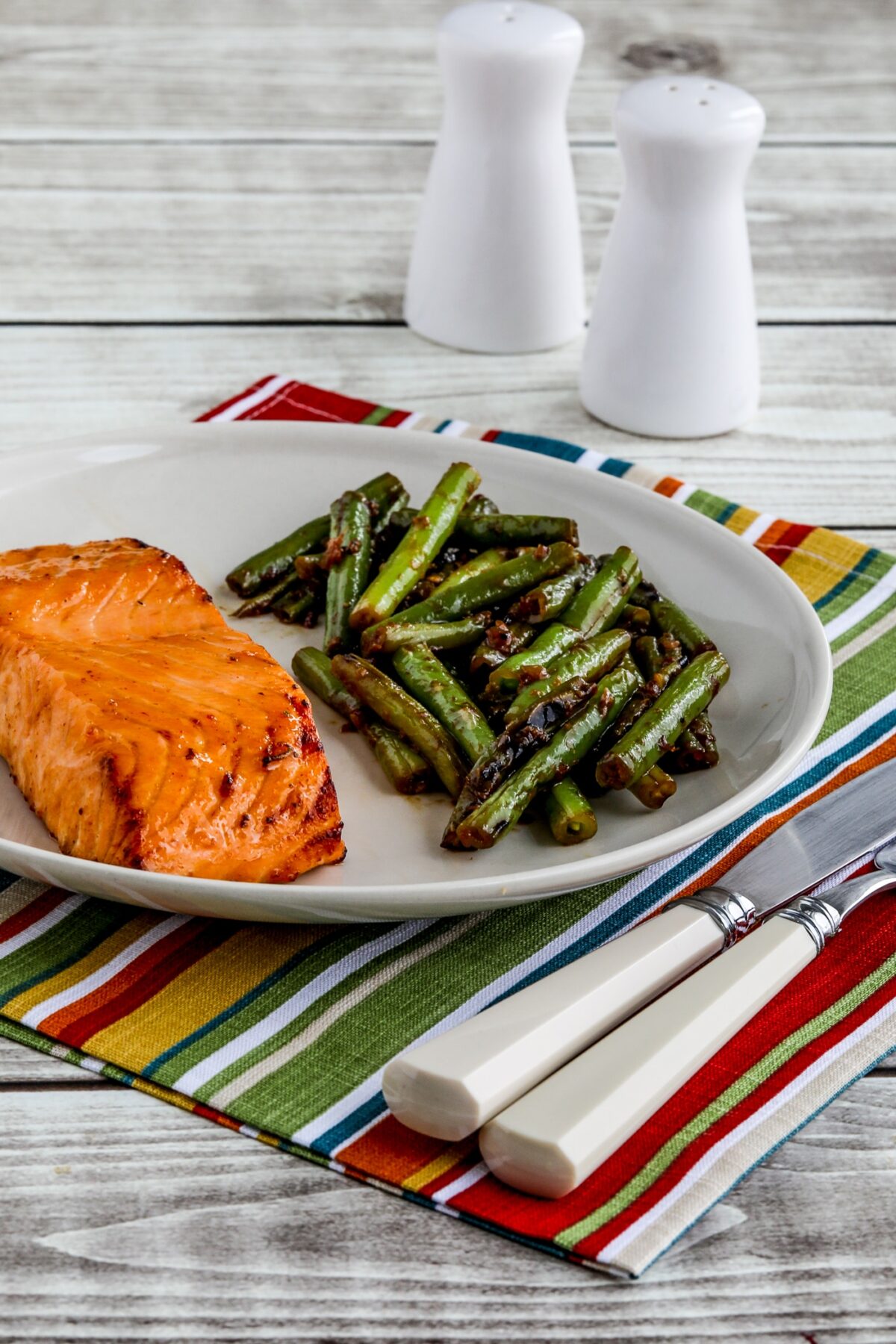 Maple Glazed Salmon shown on serving plate with green beans