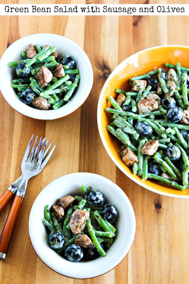 Green Bean Salad with Sausage and Olives finished salad in serving bowl and individual bowls
