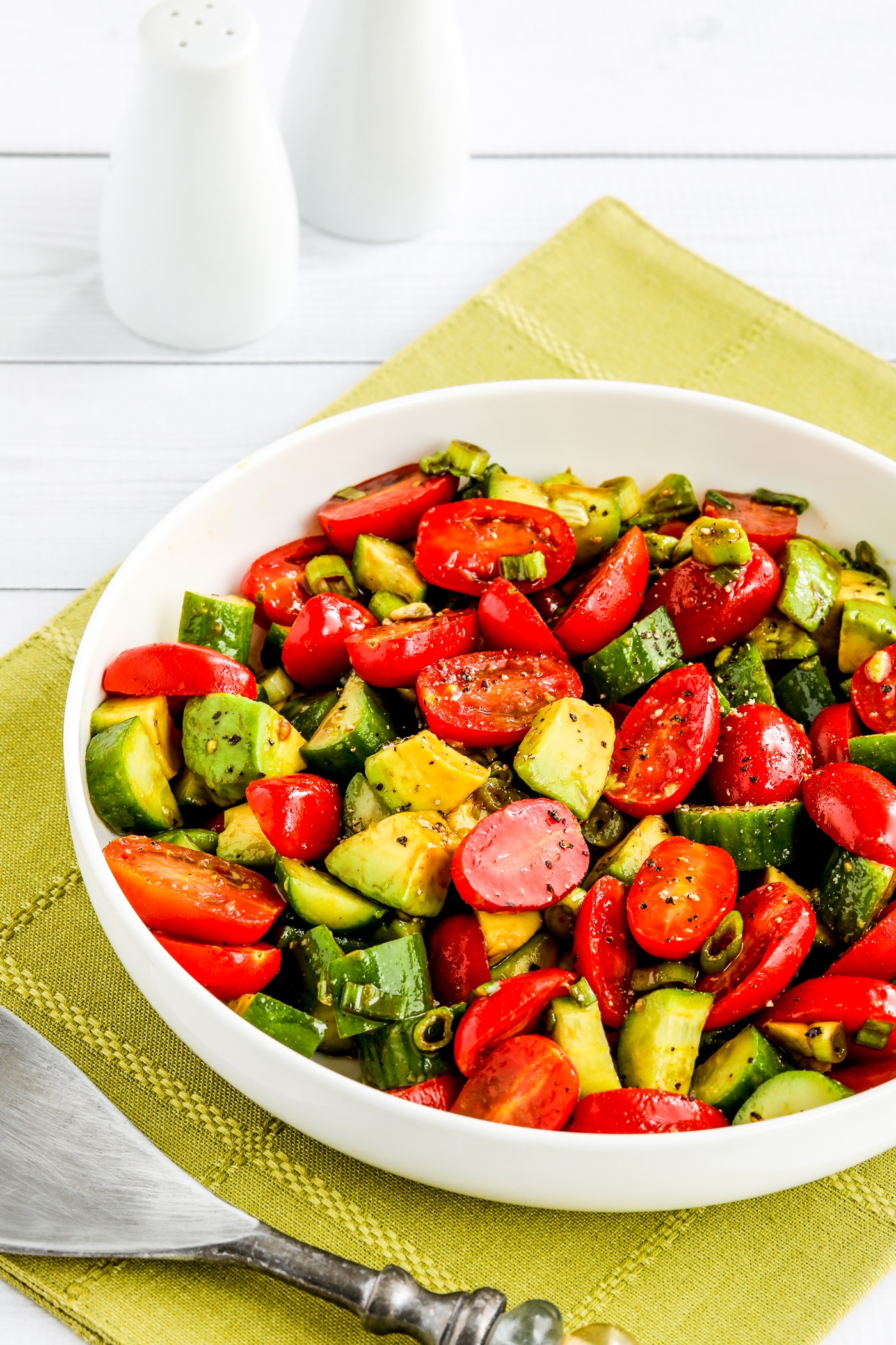 close-up shot of Tomato Cucumber Avocado Salad photo of finished salad in serving bowl