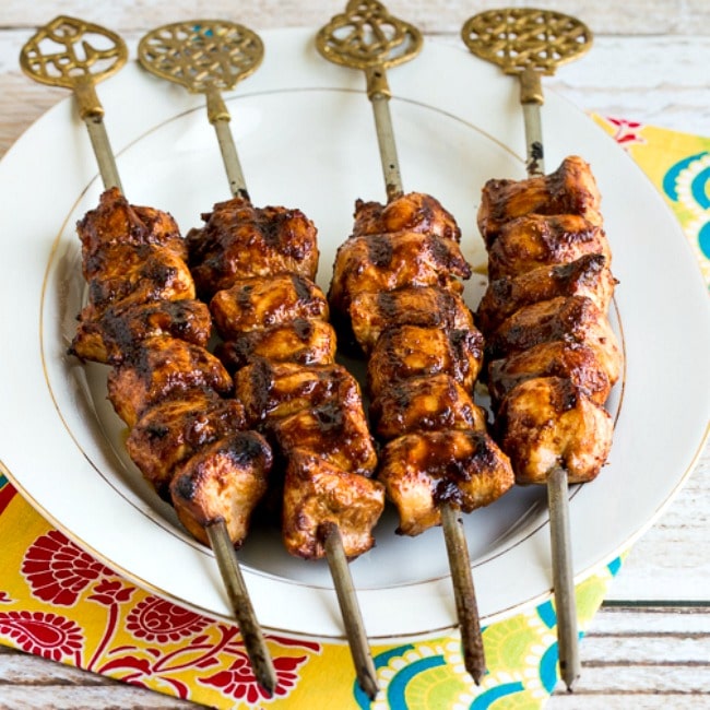 thumbnail image for Sriracha-Glazed Grilled Chicken Kabobs of finished kabobs on serving plate