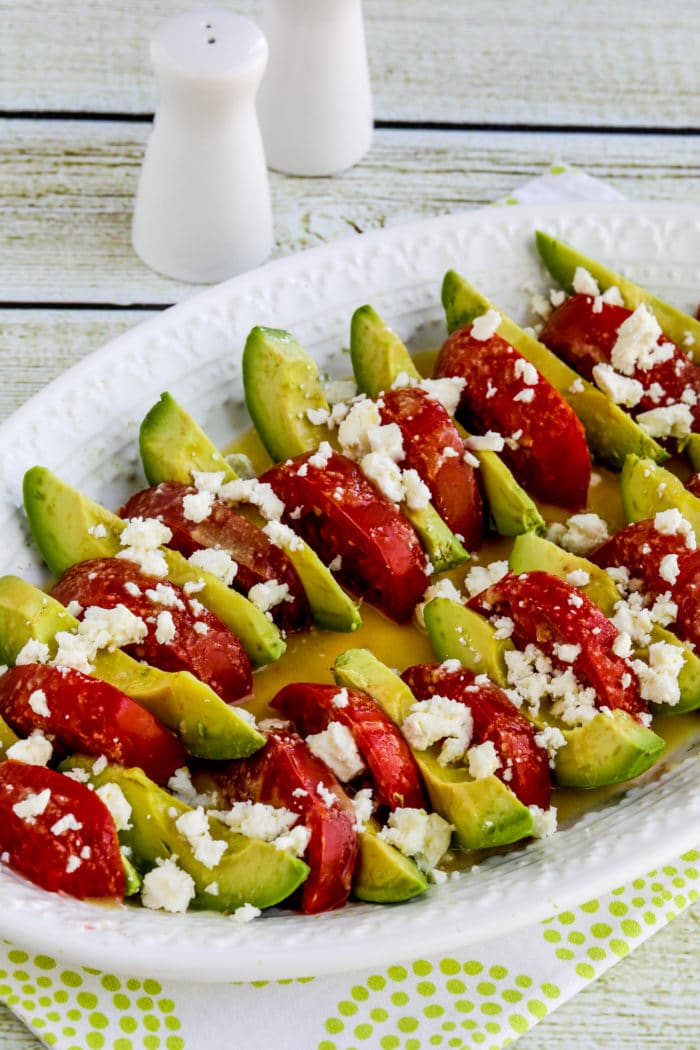 Avocado Tomato Salad on serving plate with crumbled Feta