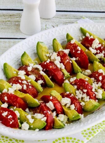 Close-up of Avocado Tomato Salad on serving plate with crumbled Feta