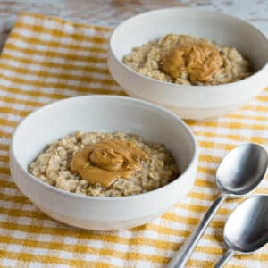 square image of Peanut Butter Oatmeal in two serving bowls