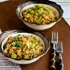 Square image for zSlow Cooker Rice with Sausage and Peppers in two bowls with forks.