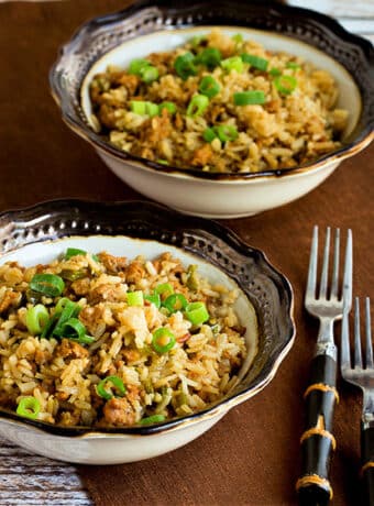 Square image for zSlow Cooker Rice with Sausage and Peppers in two bowls with forks.