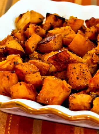 Butternut Squash with Rosemary and Balsamic Vinegar shown in serving bowl on napkin