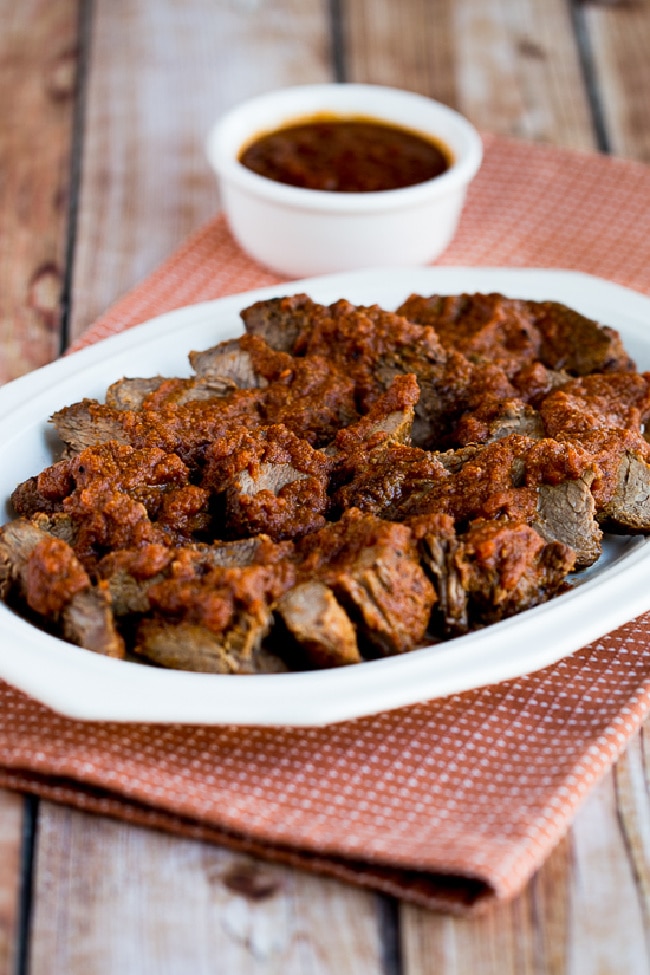 Slow Cooker Sweet and Sour Pot Roast on serving plate with sauce