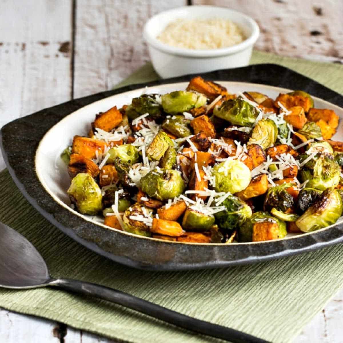 Square image of sweet potatoes and brussels sprouts on a serving plate