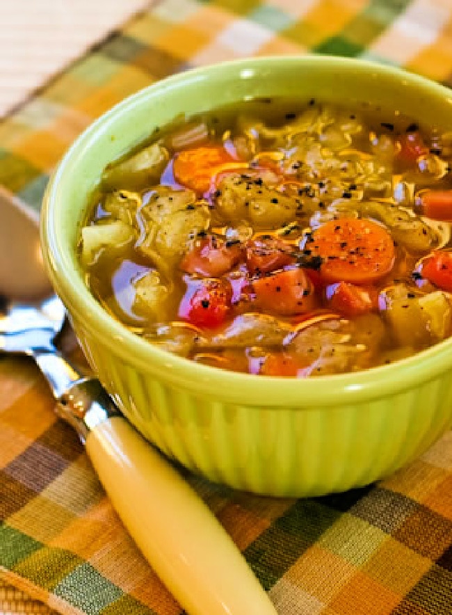 Slow Cooker Ham and Cabbage Soup finished soup in bowl with spoon