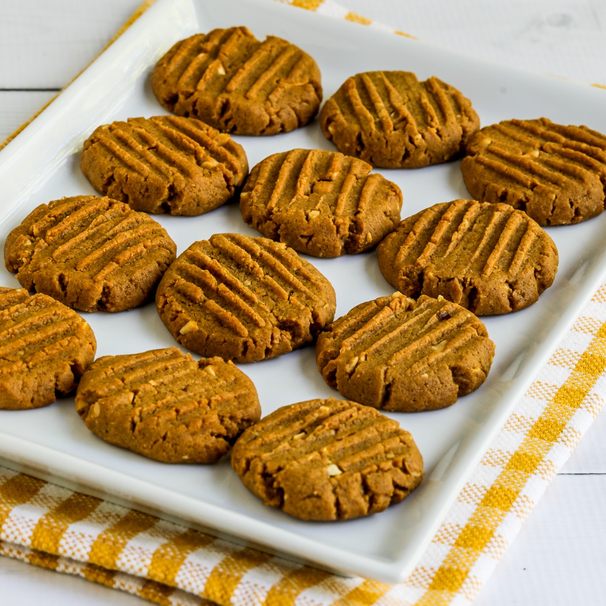 Sugar-Free Peanut Butter Cookies on serving plate on checked napkin.