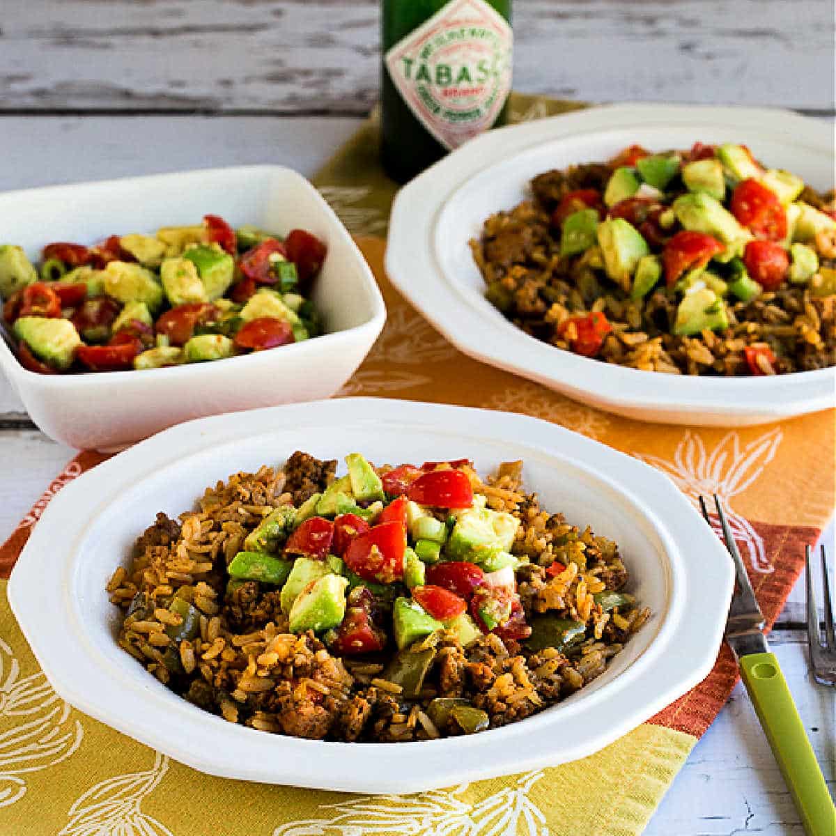 Slow Cooker Turkey Taco Bowls shown in two serving bowls with salsa.