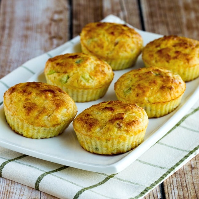 Cottage Cheese and Egg Breakfast Muffins with Ham and Cheddar square image of cooked muffins on serving plate
