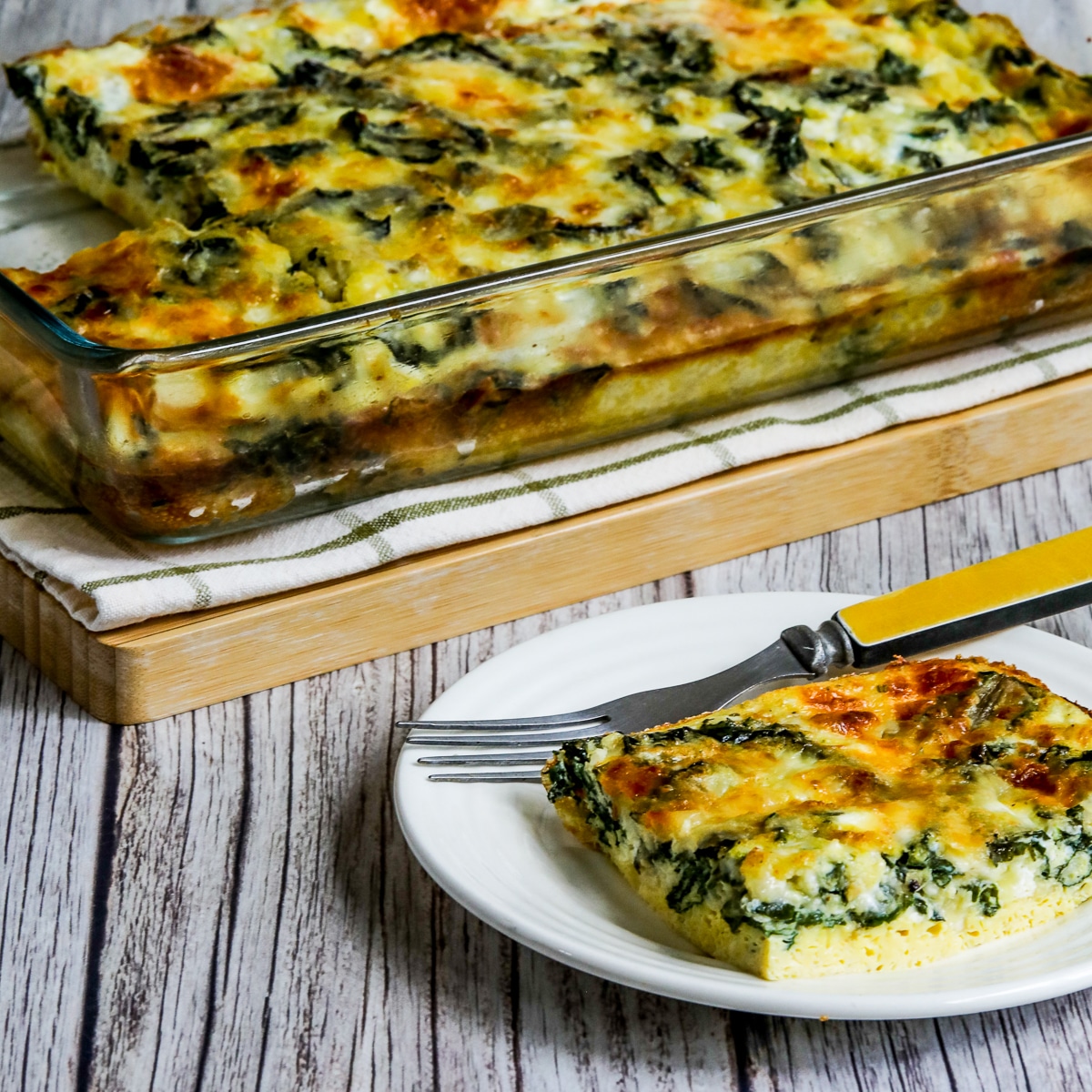 Square image for Swiss Chard Egg Bake (with Cottage Cheese) shown with one serving on plate and baking dish in back.