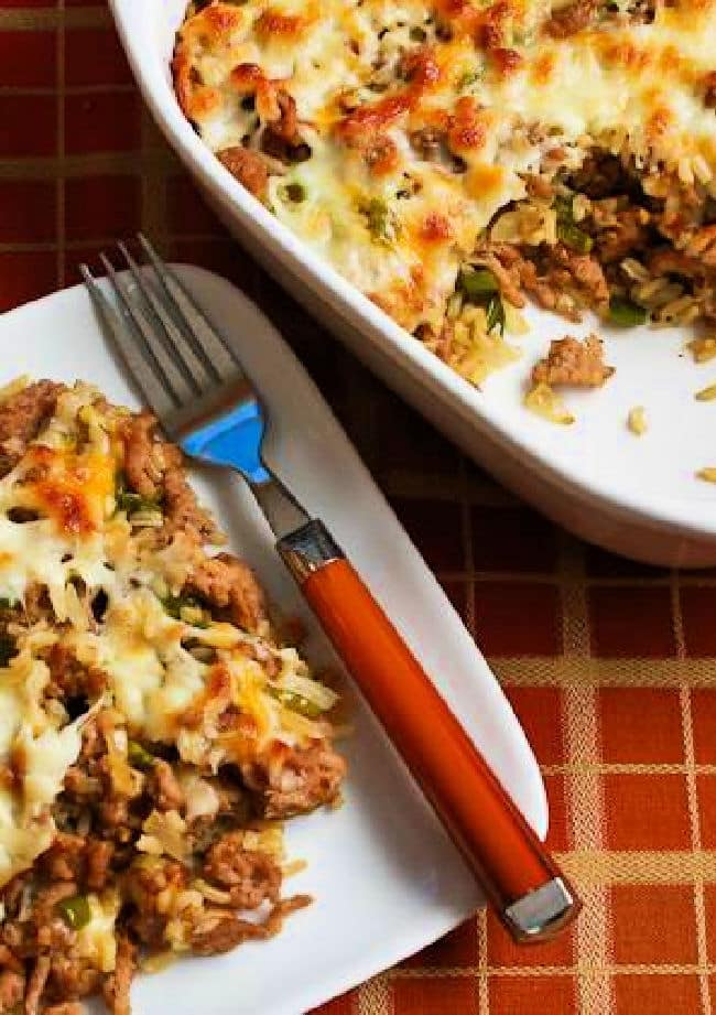 Brown Rice Casserole with Sausage and Peppers shown on plate and in baking dish.