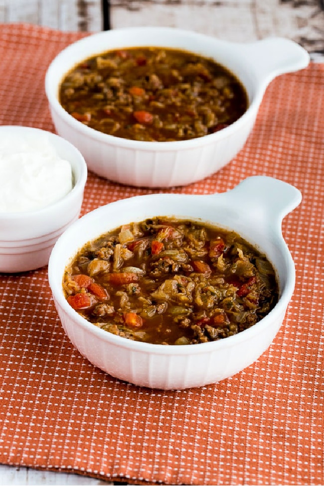 Ground beef and sauerkraut soup in two serving bowls