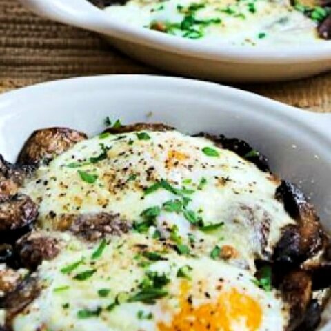 Baked Eggs with Mushrooms and Parmesan shown in two gratin dishes.