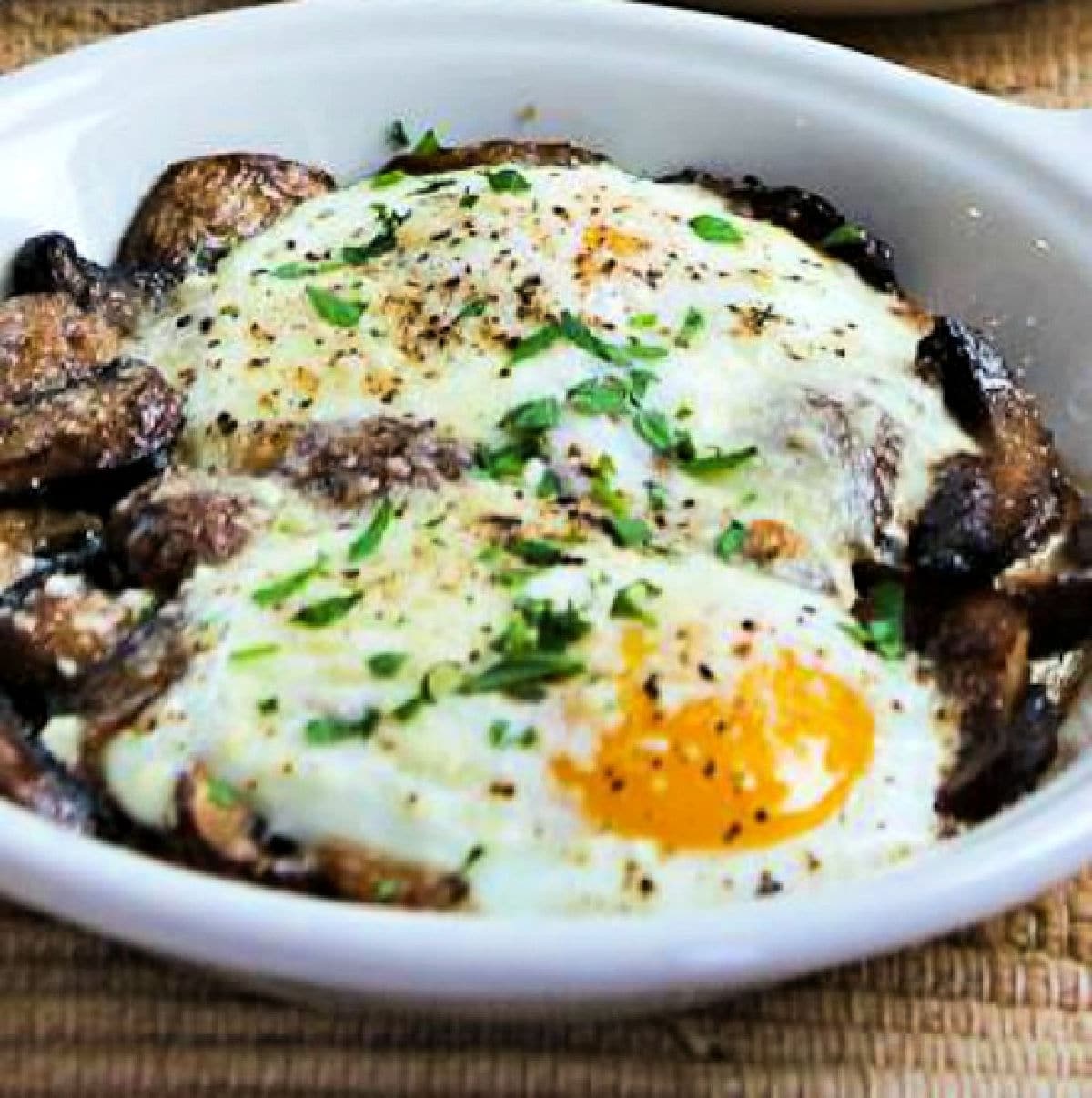 Square image for Baked Eggs with Mushrooms and Parmesan shown in gratin dishes.