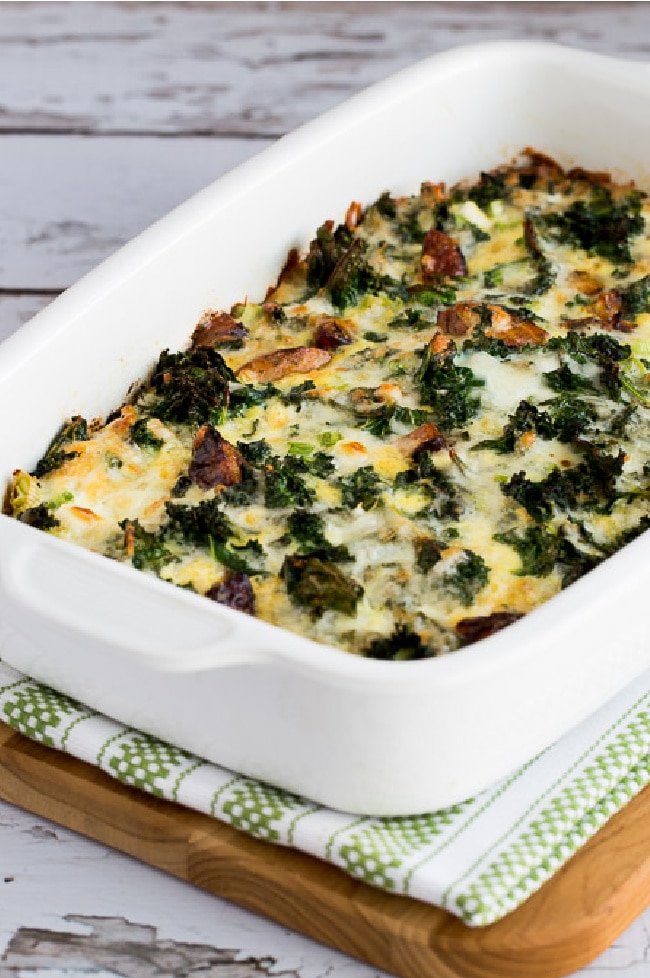 Sausage, Kale, and Mozzarella Egg Bake shown in baking dish on napkin