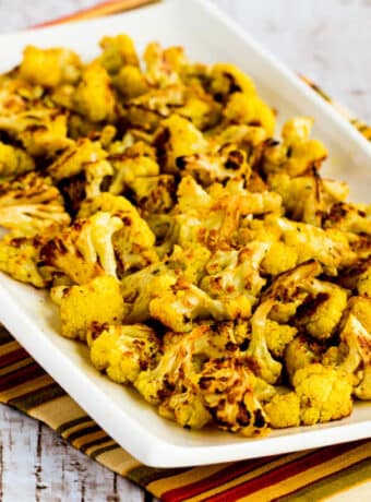 Curry Roasted Cauliflower shown on serving plate.
