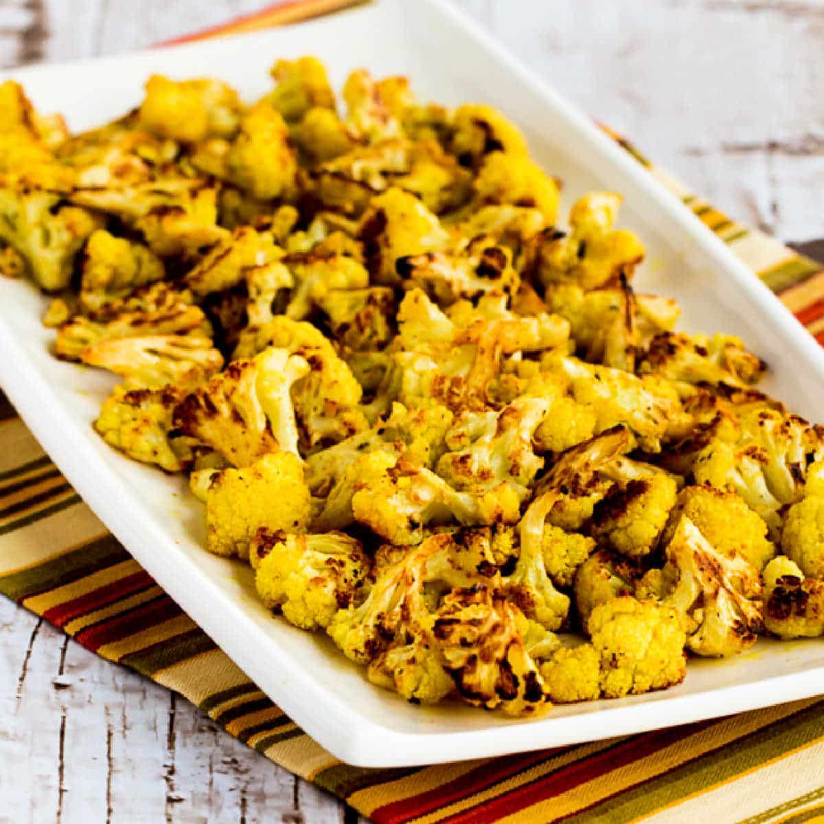 Square image of Curry Roasted Cauliflower on serving platter.