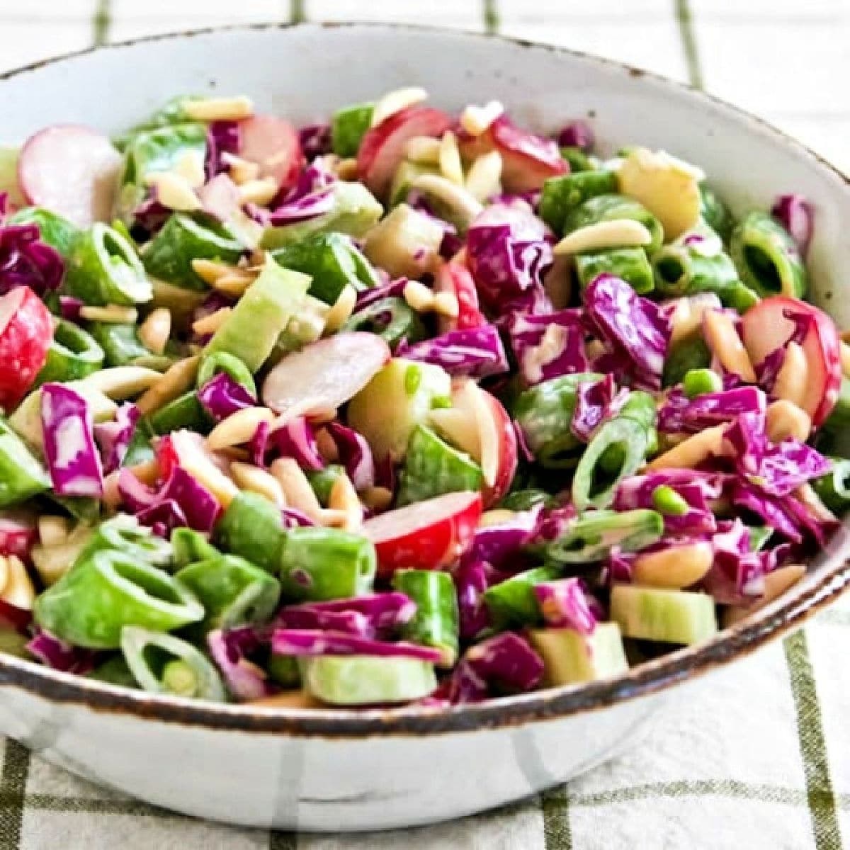 Square image for Asian Chopped Salad shown in serving bowl on napkin.