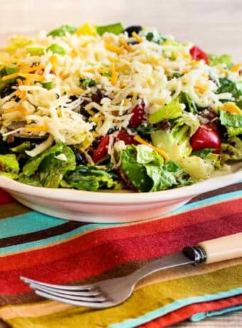 Square image for Black Bean Taco Salad in large bowl with fork.