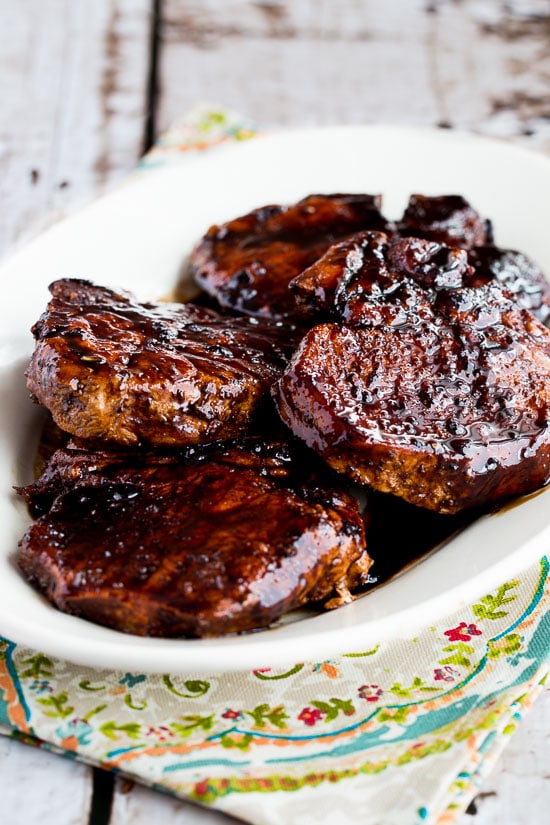 Pork chops with balsamic glaze shown on serving plate