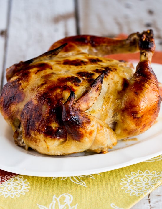 baked whole chicken on serving plate