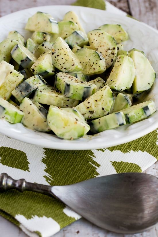 Cucumbers Caesar close-up shot in salad bowl with fork