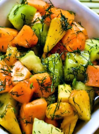 Square image of Fruit Salad with Melon, Pineapple, and Dill in bowl.