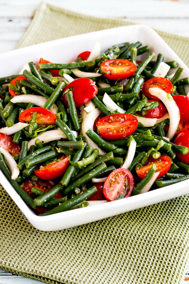 close-up photo of Green Bean and Tomato Salad in serving bowl
