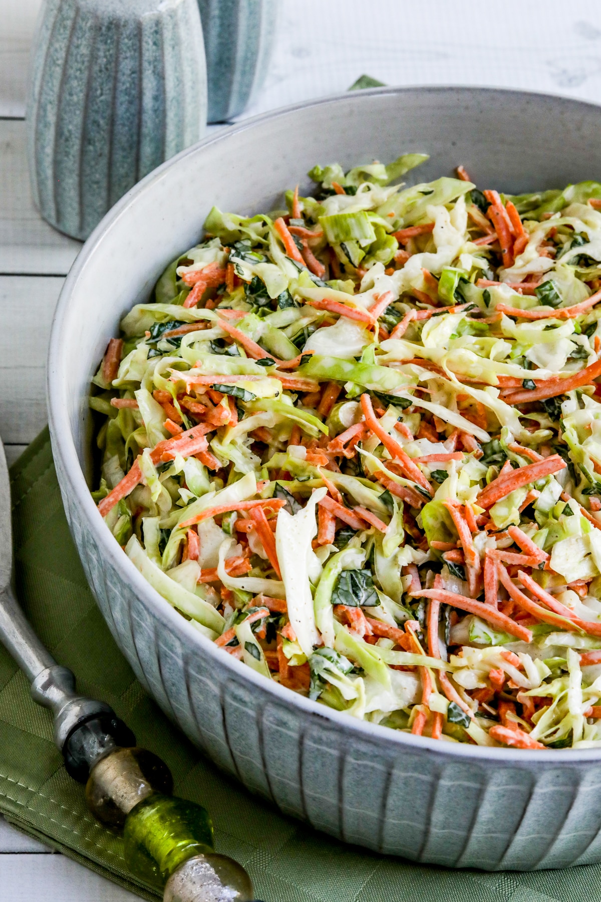 Moroccan Salad in bowl with salt-pepper in back and fork.