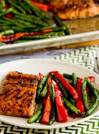 square image of Asian Salmon and Green Beans Sheet Pan Meal on serving plate with sheet pan in background