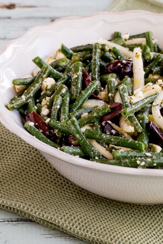 Green Bean Salad with Greek Olives and Feta Cheese close-up photo of finished salad in serving bowl