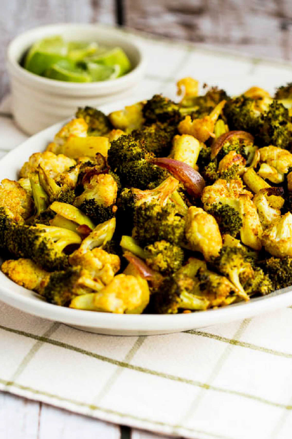 Roasted Broccoli and Cauliflower shown on serving plate 
