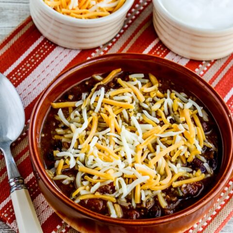 Pumpkin Chili with Ground Beef finished chili in bowl with toppings