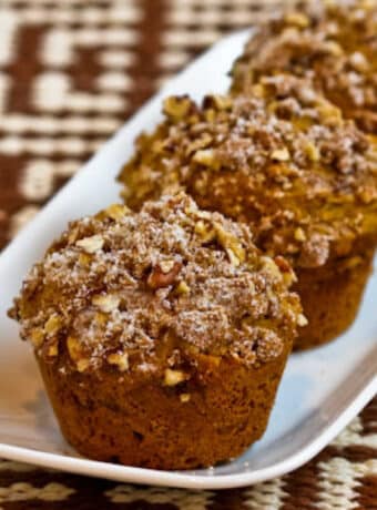 Sugar-Free Whole Wheat Pumpkin Muffins showing three muffins on small platter