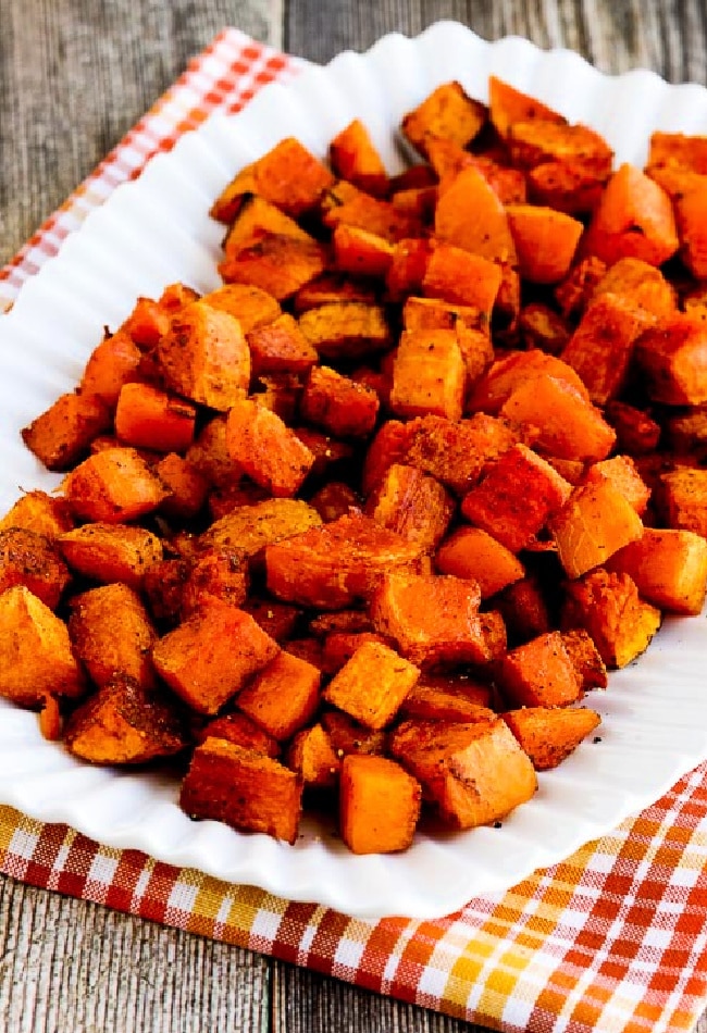 Roasted Butternut Squash with Moroccan Spices (or Smoked Paprika) shown on serving platter with plaid napkin